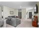 Bright and cozy living room with a plush gray sofa and a view of the entry at 483 Pender Woods Dr, Summerville, SC 29486