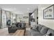 Open-concept living room featuring hardwood floors, natural light, and a cozy fireplace at 483 Pender Woods Dr, Summerville, SC 29486