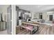 Open concept living space featuring a modern kitchen, wood floors, and neutral decor with a dining area at 483 Pender Woods Dr, Summerville, SC 29486