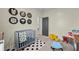 Bright room featuring Avengers decor, a grey crib, and carpet floors at 483 Pender Woods Dr, Summerville, SC 29486