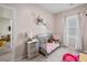 Bright room featuring a bed, pink decor, and carpet floors at 483 Pender Woods Dr, Summerville, SC 29486