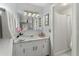 Bright bathroom showcasing a vanity with framed mirror, great lighting, and shower at 49 Crosscreek Dr, Charleston, SC 29412