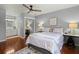 Comfortable bedroom featuring a ceiling fan, area rug, and ensuite bathroom at 49 Crosscreek Dr, Charleston, SC 29412