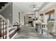 Bright eat-in kitchen with tile floors, stainless appliances, and staircase to the left at 49 Crosscreek Dr, Charleston, SC 29412