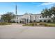 Beautiful building exterior featuring a covered entrance, manicured landscaping, and accessible parking at 49 Crosscreek Dr, Charleston, SC 29412