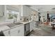 Bright kitchen with an open design that leads to a dining area with a fireplace at 49 Crosscreek Dr, Charleston, SC 29412