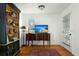 Bright living room with hardwood floors, a vintage bookcase, and a large window at 49 Crosscreek Dr, Charleston, SC 29412