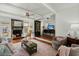 Bright and airy living room featuring a stone fireplace, wood floors, and comfortable seating for relaxing and entertaining at 49 Crosscreek Dr, Charleston, SC 29412