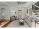 Comfortable living room with a staircase, area rug, and a large window at 49 Crosscreek Dr, Charleston, SC 29412