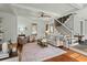 Cozy living room with a plush rug, neutral furniture, and a staircase at 49 Crosscreek Dr, Charleston, SC 29412