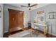 Home office featuring a large wooden armoire, modern desk, and natural light at 49 Crosscreek Dr, Charleston, SC 29412
