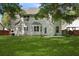 Large, grassy backyard featuring a patio and well-maintained lawn at 5418 Percival Ln, Charleston, SC 29420
