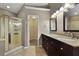 Elegant bathroom features a double vanity, walk-in shower, and a walk-in closet for ample storage at 5418 Percival Ln, Charleston, SC 29420