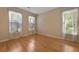 Bedroom showcasing ample natural light, neutral walls, and hardwood flooring at 5418 Percival Ln, Charleston, SC 29420