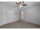 Bedroom with carpet, ceiling fan, closet and a two shelves for storage or decor at 5418 Percival Ln, Charleston, SC 29420