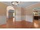 Dining room with wood floors, chair rail and access to the kitchen and living areas at 5418 Percival Ln, Charleston, SC 29420