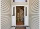 Open doorway reveals hardwood floors and stairs with white trim and a Welcome mat at 5418 Percival Ln, Charleston, SC 29420