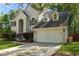 Beautiful home with an attached garage, well-kept lawn, and classic architectural features at 5418 Percival Ln, Charleston, SC 29420