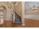 Foyer with hardwood floors leading to carpeted stairs and an archway to the dining room at 5418 Percival Ln, Charleston, SC 29420