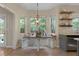 Bright breakfast nook with lots of light and open access to living room at 5418 Percival Ln, Charleston, SC 29420