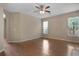 Open living room featuring hardwood floors and a ceiling fan at 5418 Percival Ln, Charleston, SC 29420