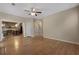 Living room with hardwood floors, view of kitchen, and staircase at 5418 Percival Ln, Charleston, SC 29420