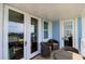Spacious balcony with multiple seating areas and stunning ocean views from multiple access points at 5802 Palmetto Dr # B-501, Isle of Palms, SC 29451
