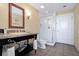 Well-lit bathroom with a walk-in shower, granite countertops, and ample storage at 5802 Palmetto Dr # B-501, Isle of Palms, SC 29451