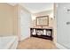 Spa-like bathroom with a soaking tub and a separate glass-enclosed shower at 5802 Palmetto Dr # B-501, Isle of Palms, SC 29451
