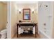 Well-lit bathroom featuring a granite vanity, tub/shower combo, and fresh white towels at 5802 Palmetto Dr # B-501, Isle of Palms, SC 29451