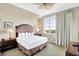 Relax in this inviting bedroom with a large window offering scenic views at 5802 Palmetto Dr # B-501, Isle of Palms, SC 29451