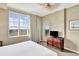 Bright bedroom featuring a large window and classic furnishings at 5802 Palmetto Dr # B-501, Isle of Palms, SC 29451