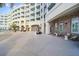 Picturesque exterior of a condo building with well manicured landscape and outdoor seating area at 5802 Palmetto Dr # B-501, Isle of Palms, SC 29451
