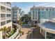 Inviting resort with charming architecture, lush landscaping, and a serene walkway at 5802 Palmetto Dr # B-501, Isle of Palms, SC 29451