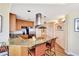 Modern kitchen with granite countertops, stainless steel appliances, and breakfast bar seating at 5802 Palmetto Dr # B-501, Isle of Palms, SC 29451