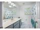 Bright bathroom featuring stylish blue accents, a large mirror, and a shower curtain at 603 Curing Ct, Moncks Corner, SC 29461