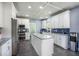 Modern kitchen featuring stainless appliances, grey tile floors, granite countertops, and island with storage at 603 Curing Ct, Moncks Corner, SC 29461