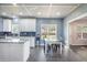 Eat in kitchen boasts stainless appliances, a breakfast bar, and backyard view at 603 Curing Ct, Moncks Corner, SC 29461