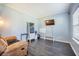 Relaxing living room with sleek floors, tv, and a comfortable recliner at 603 Curing Ct, Moncks Corner, SC 29461
