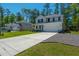 Attractive two-story home with a concrete driveway and well-kept lawn in a quiet neighborhood at 689 W Butternut Rd, Summerville, SC 29483