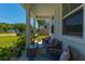 Cozy front porch with outdoor seating, plants, and a charming view of the neighborhood at 689 W Butternut Rd, Summerville, SC 29483