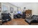 Functional office with desk space, shelving, and a chaise lounge, perfect for a home workspace at 689 W Butternut Rd, Summerville, SC 29483