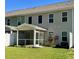 Spacious backyard with green lawn, patio, and privacy fence at 703 Hilchot Dr, Summerville, SC 29486