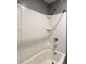 Bright tub and shower combo featuring a built-in shampoo and soap holder with a standard shower head at 703 Hilchot Dr, Summerville, SC 29486