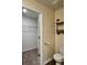 Bathroom featuring open closet and toilet near industrial-style shelving at 703 Hilchot Dr, Summerville, SC 29486