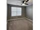 Bedroom featuring natural light from a window, a ceiling fan, and neutral colored walls and carpet flooring at 703 Hilchot Dr, Summerville, SC 29486