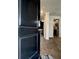 Inviting entryway features wood floors and a glimpse into the modern kitchen at 703 Hilchot Dr, Summerville, SC 29486