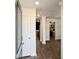 Bright entryway showcases hardwood floors, leading to an open kitchen and living space at 703 Hilchot Dr, Summerville, SC 29486