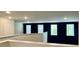 Hallway view showcasing windows with natural light, recessed lights, and dark walls complimenting the white trim at 703 Hilchot Dr, Summerville, SC 29486