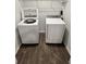 Modern laundry room with a white Samsung washer and dryer at 703 Hilchot Dr, Summerville, SC 29486